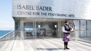 Queen’s traditional piper at the Isabel Bader Centre.